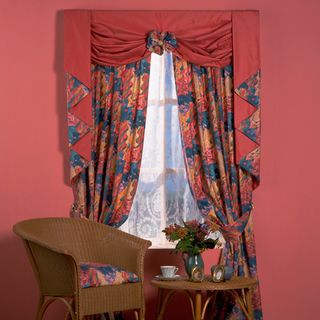 pink wall with curtain on window