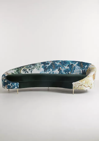Anthropologie curved peacock print sofa.