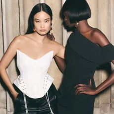 Models wearing a white Karen Millen corset and black dress