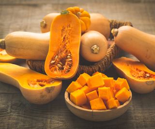 Whole, halved, and cubed butternut squashes