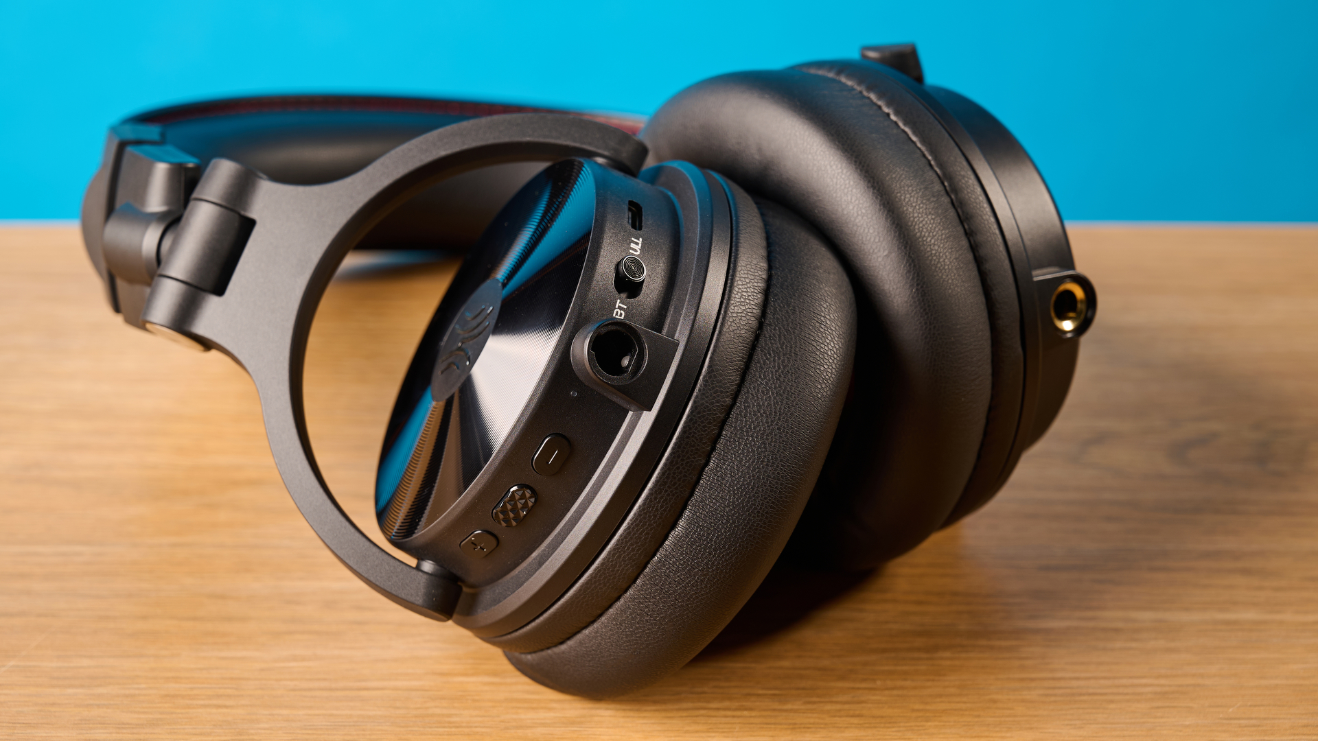 OneOdio Studio Max 2 in black photographed in front of a blue background