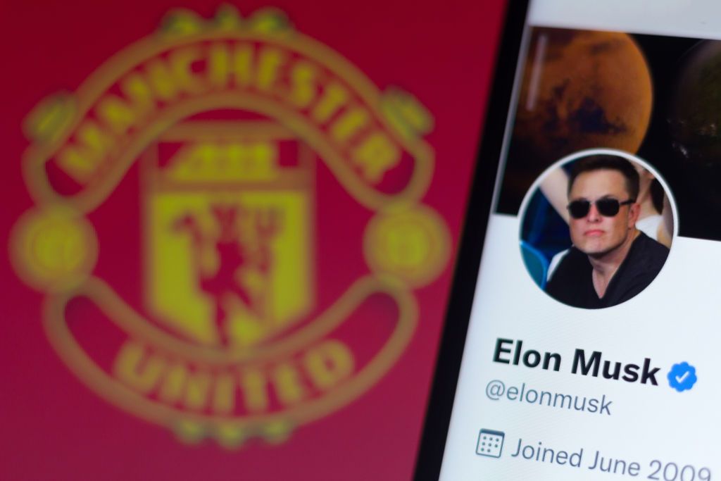 Manchester United and Elon Musk: In this photo illustration, the official profile of Elon Musk on the social network Twitter and in the background, the Manchester United Football Club logo.