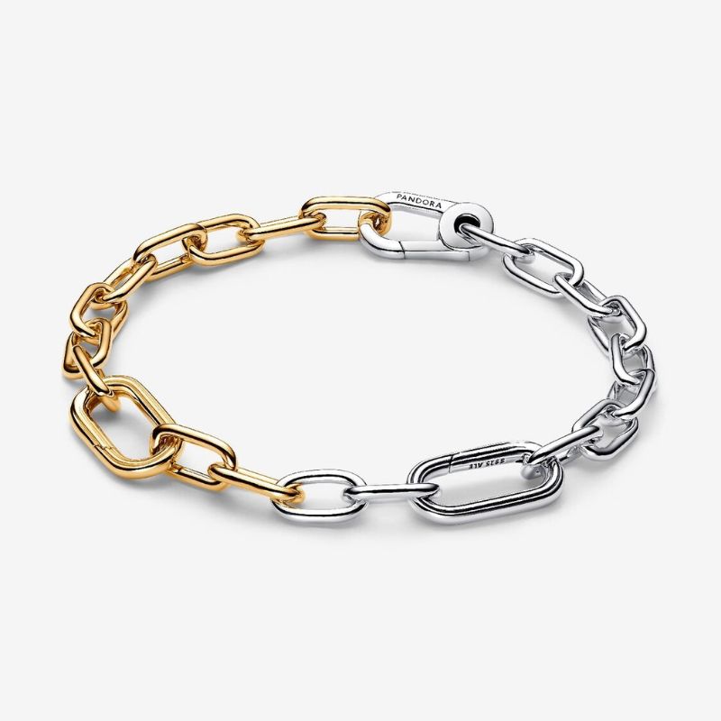 A cutout of a link bracelet that is both gold and silver