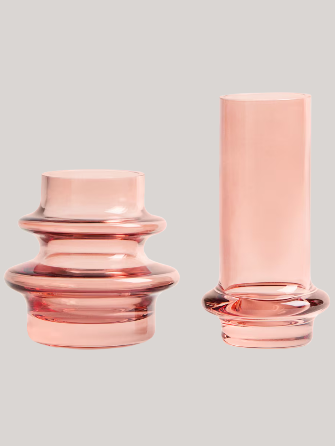 A set of two pink bud vases