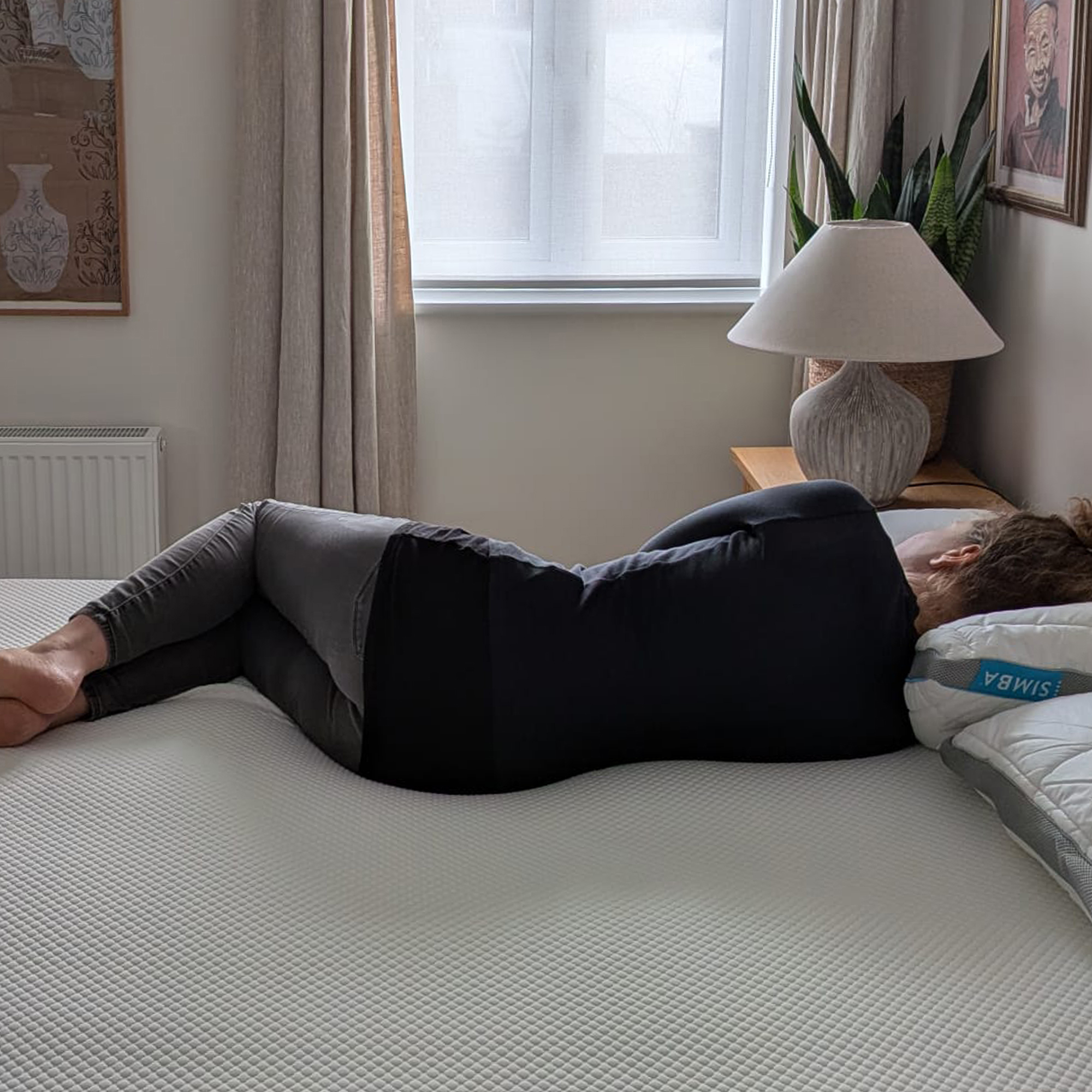 Person testing bedding