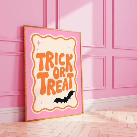 Pink Trick or Treat print againt a pink panelled wall