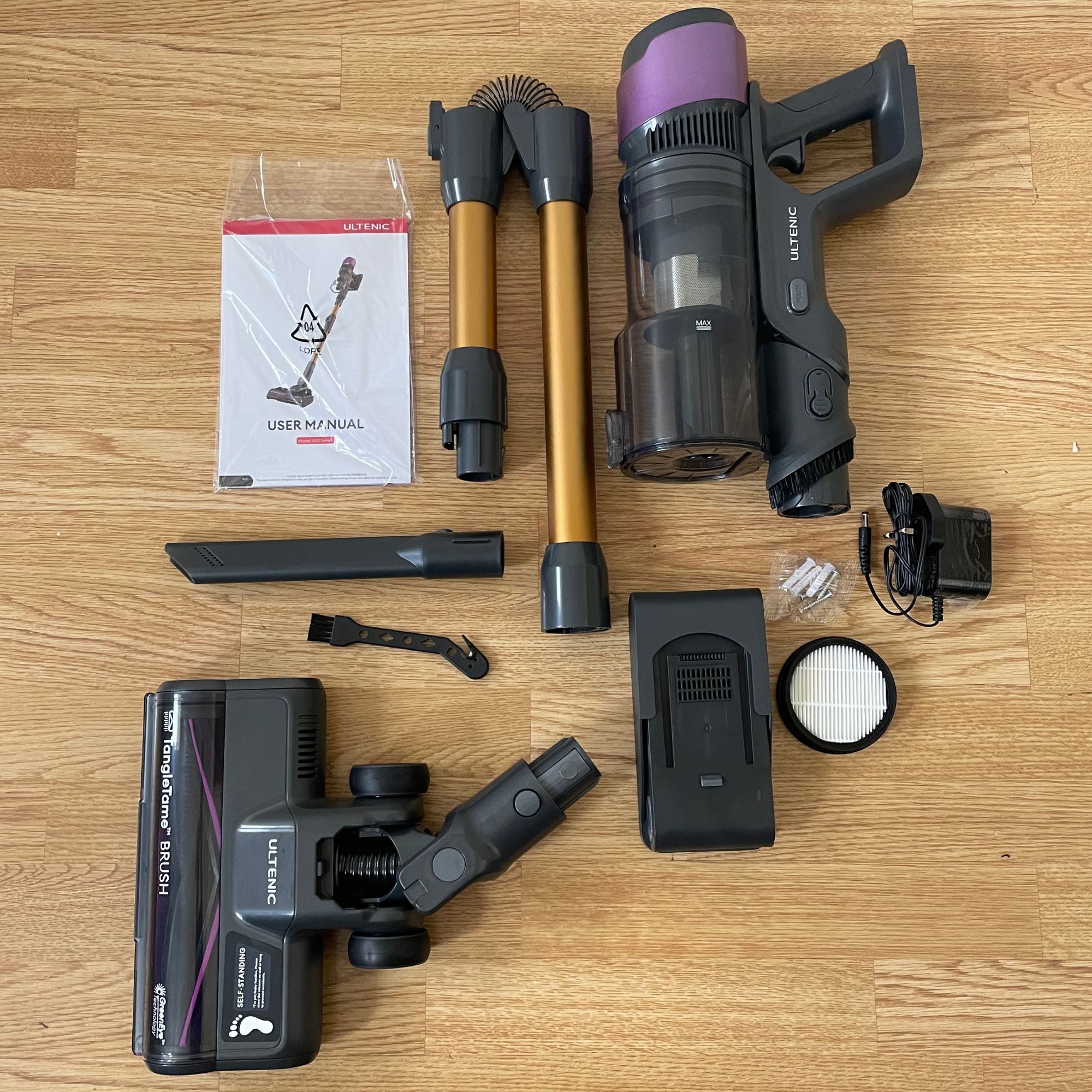 Ultenic U20 cordless vacuum components laid out on laminate floor