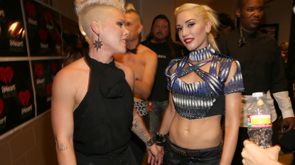 Singers Pink (L) and Gwen Stefani of No Doubt pose backstage during the 2012 iHeartRadio Music Festival at the MGM Grand Garden Arena on September 21, 2012 in Las Vegas, Nevada.