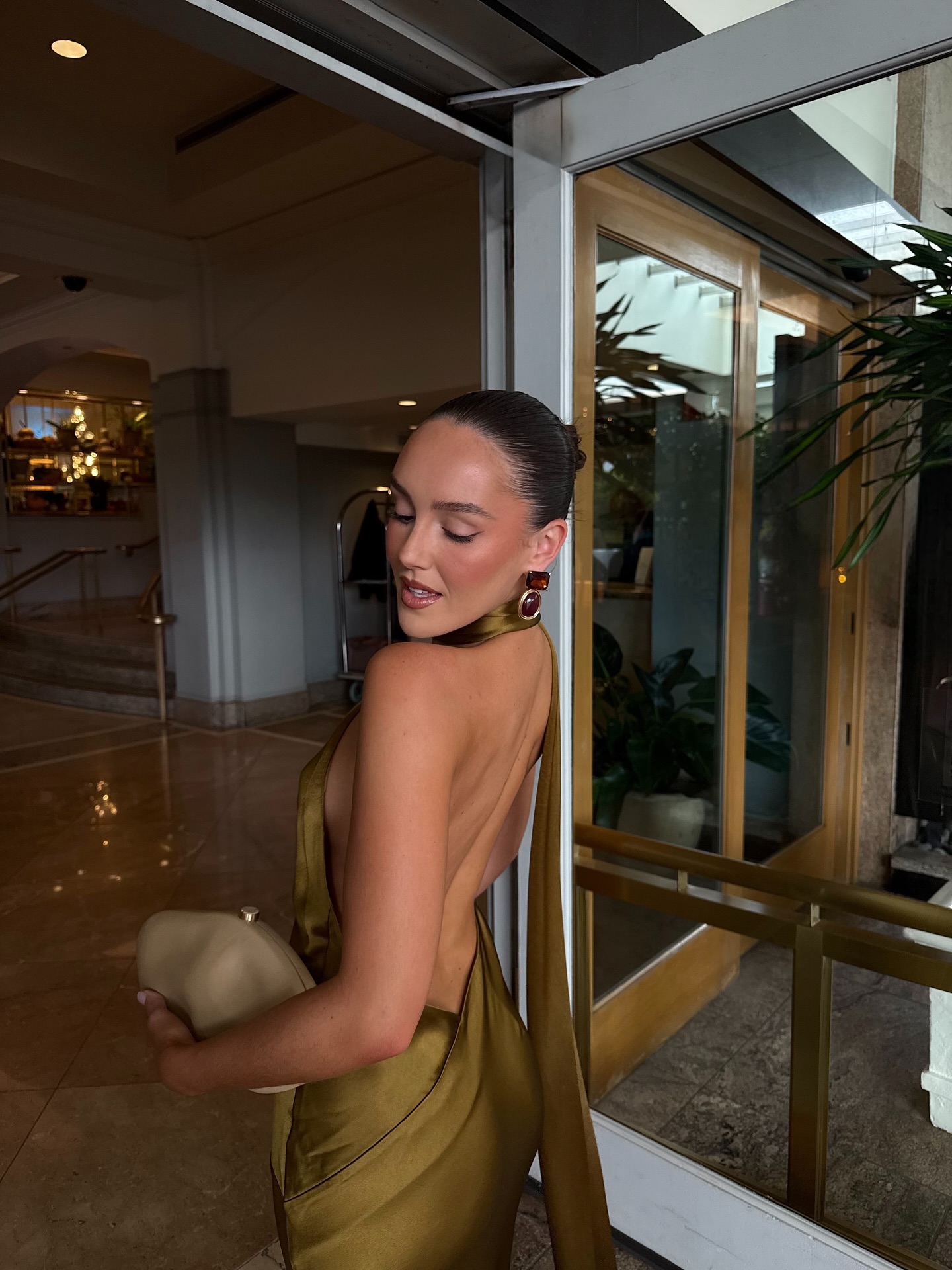 Emma Leger in a green Retrofete dress