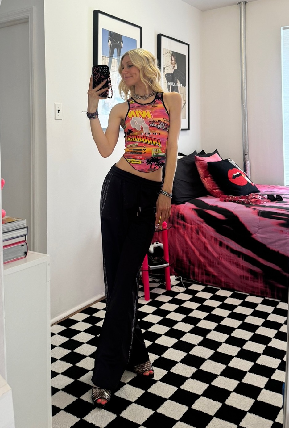 Jessica Minkoff posing in mirror wearing track pants 