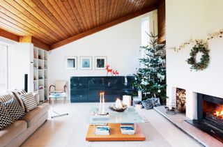 double height living space with sloping vaulted ceiling in a 1970s self build home