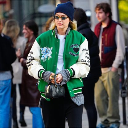 Gigi Hadid in a green varsity jacket