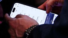 Former National Security Adviser Mike Waltz is seen using the TeleMessage app during a White House cabinet meeting.