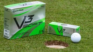 A box of TaylorMade V3 Soft golf balls sitting on the putting green at Gleneagles