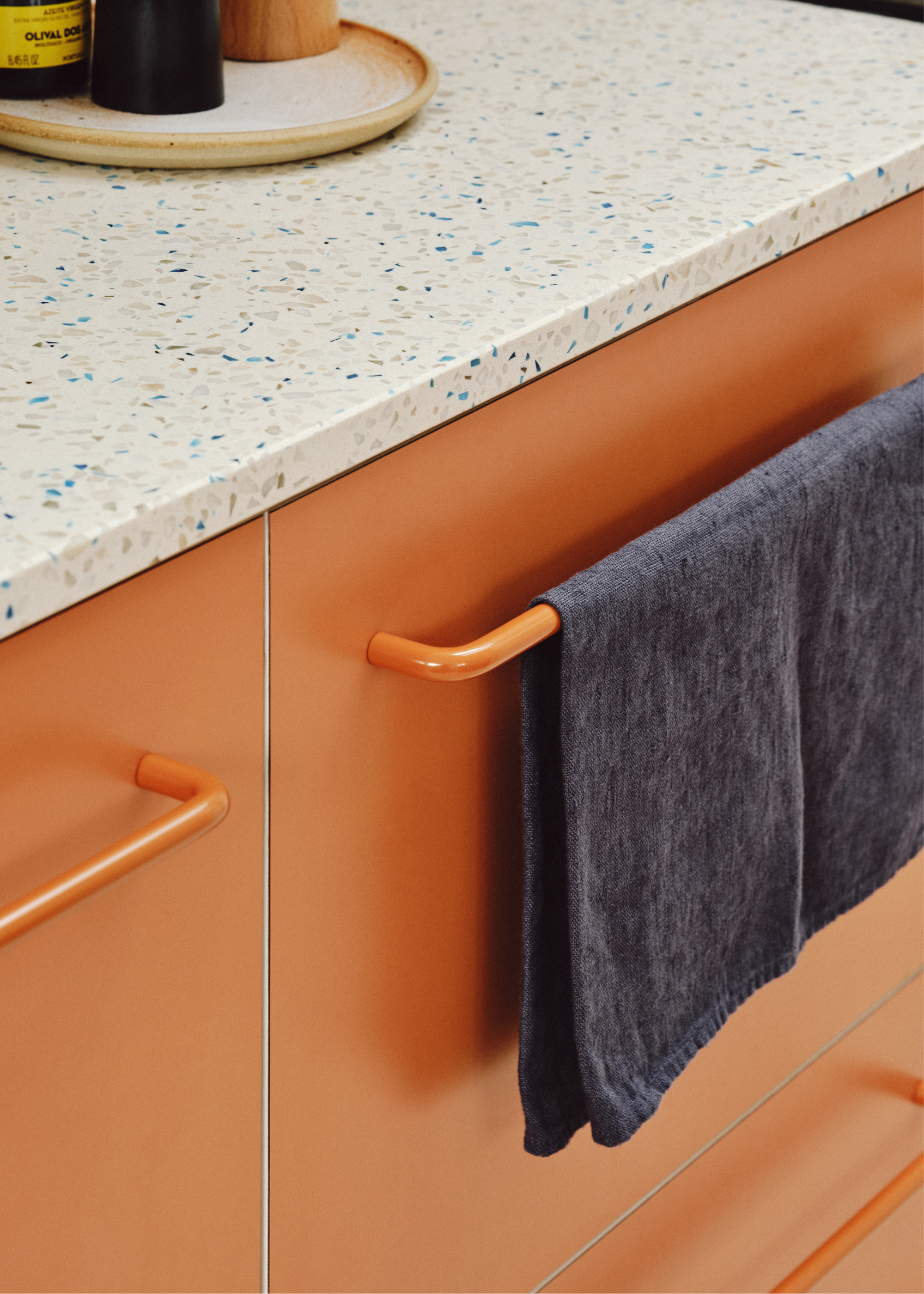 Orange cabinets with matching orange pulls