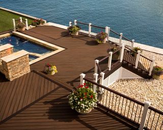 trex decking around swimming pool with railings and sea view