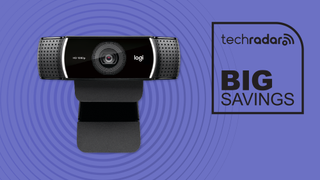 The Logitech C920 webcam facing straight forward on a purple background