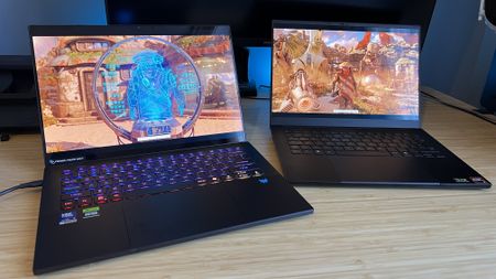 Razer Blade 14 and Acer Predator Triton 14 AI gaming laptops on a wooden desk