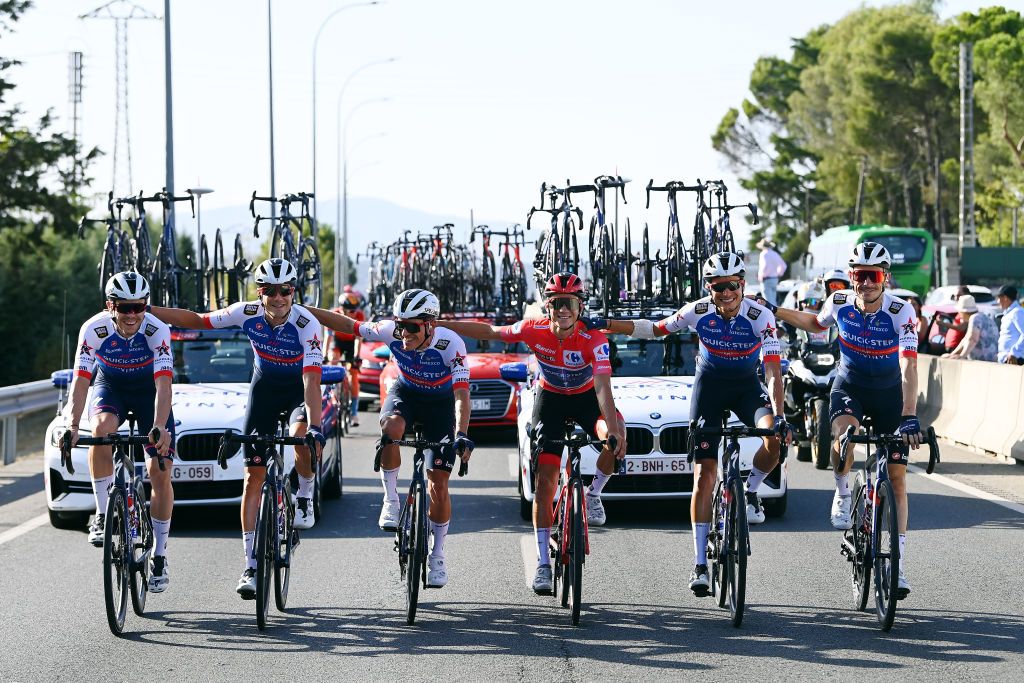 MADRID SPAIN SEPTEMBER 11 LR Rmi Cavagna of France Ilan Van Wilder of Belgium Remco Evenepoel of Belgium Red Leader Jersey Fausto Masnada of Italy Dries Devenyns of Belgium and Louis Vervaeke of Belgium and Team QuickStep Alpha Vinyl celebrateduring the 77th Tour of Spain 2022 Stage 21 a 967km stage from Las Rozas to Madrid LaVuelta22 WorldTour on September 11 2022 in Madrid Spain Photo by Tim de WaeleGetty Images