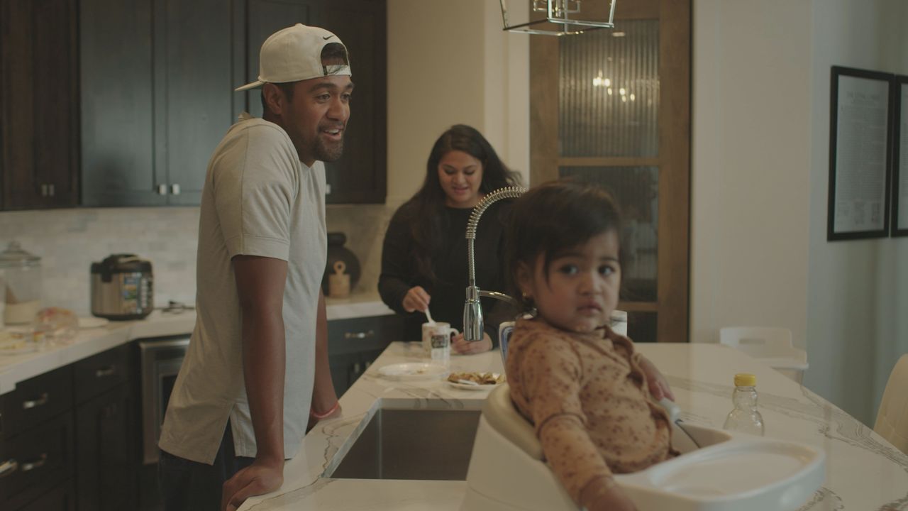 Tony Finau and his family in the kitchen