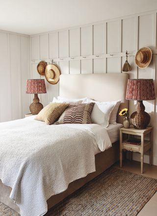 Rustic bedroom with rattan table lamps from Oka