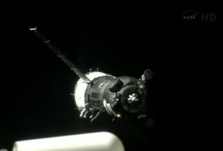 A Soyuz spacecraft carrying the Expedition 36/37 crew to the International Space Station is seen in station cameras just before docking on May 28, 2013.
