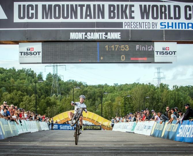 Anton Cooper celebrating the win at the UCI Under 23 Mountain Bike World Cup at Mont Sainte Anne, Canada