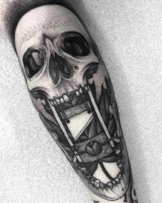 Gruesome skull tattoo