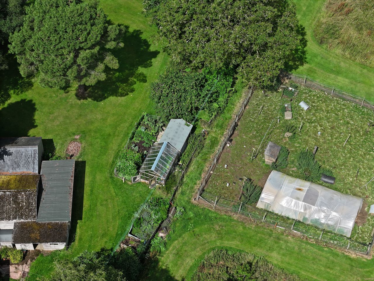 DJI Air 3 photo of a large garden and allotment on a sunny day with the 70mm telephoto camera