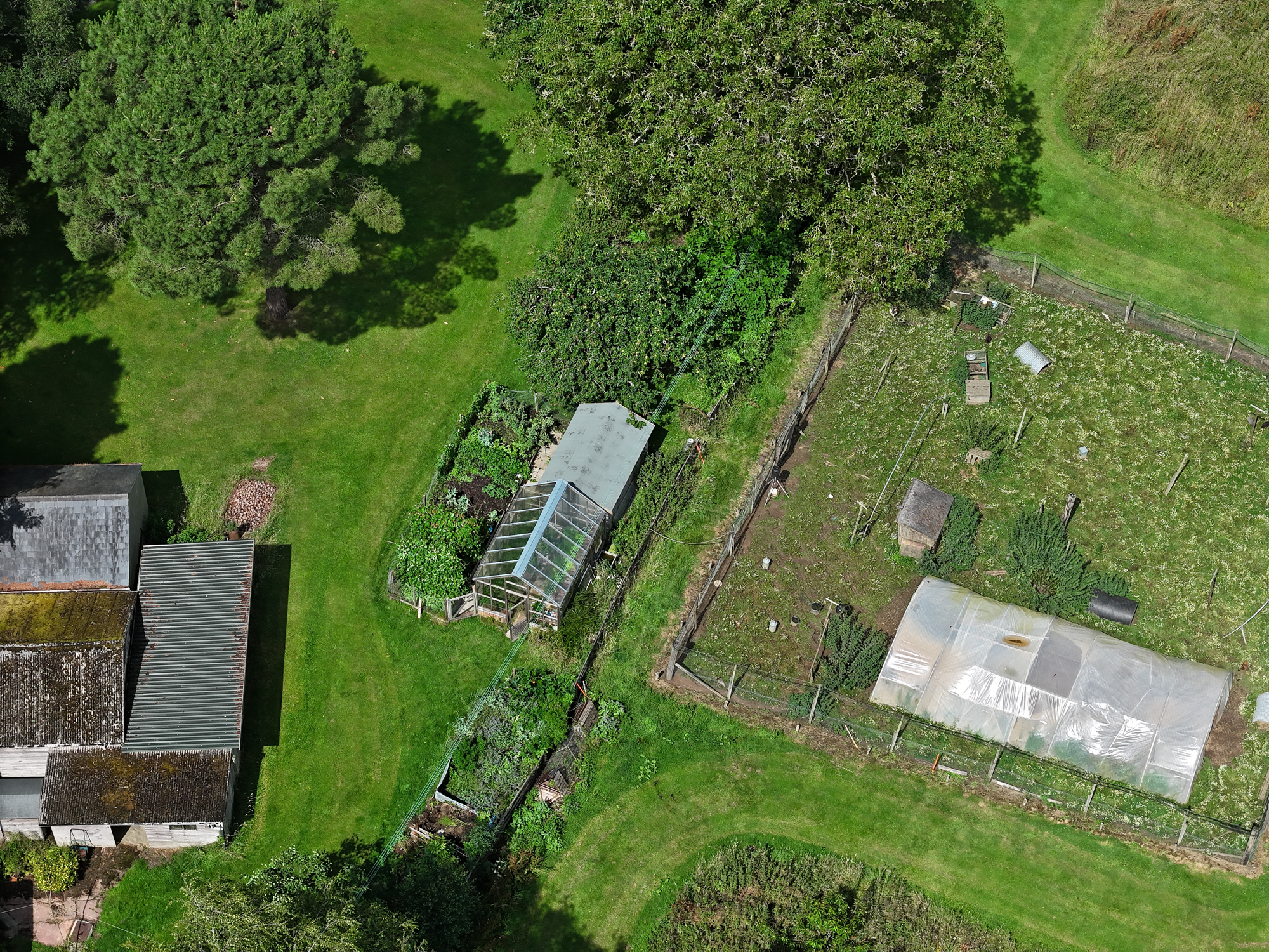DJI Air 3 photo of a large garden and allotment  on a sunny day with the 70mm telephoto camera