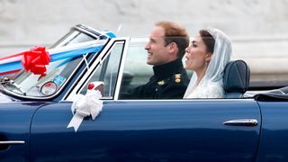 Prince William and Kate Middleton leaving their wedding in an Aston Martin