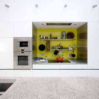 kitchen with yellow wall and electric oven