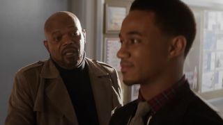 Samuel L Jackson speaks to Jesse T Usher in a hallway in Shaft.