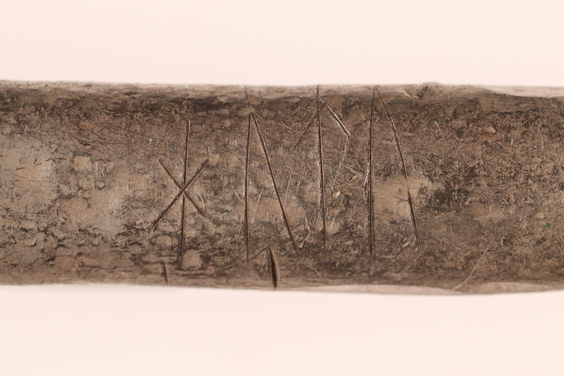 A close up of runs on a silver bar.