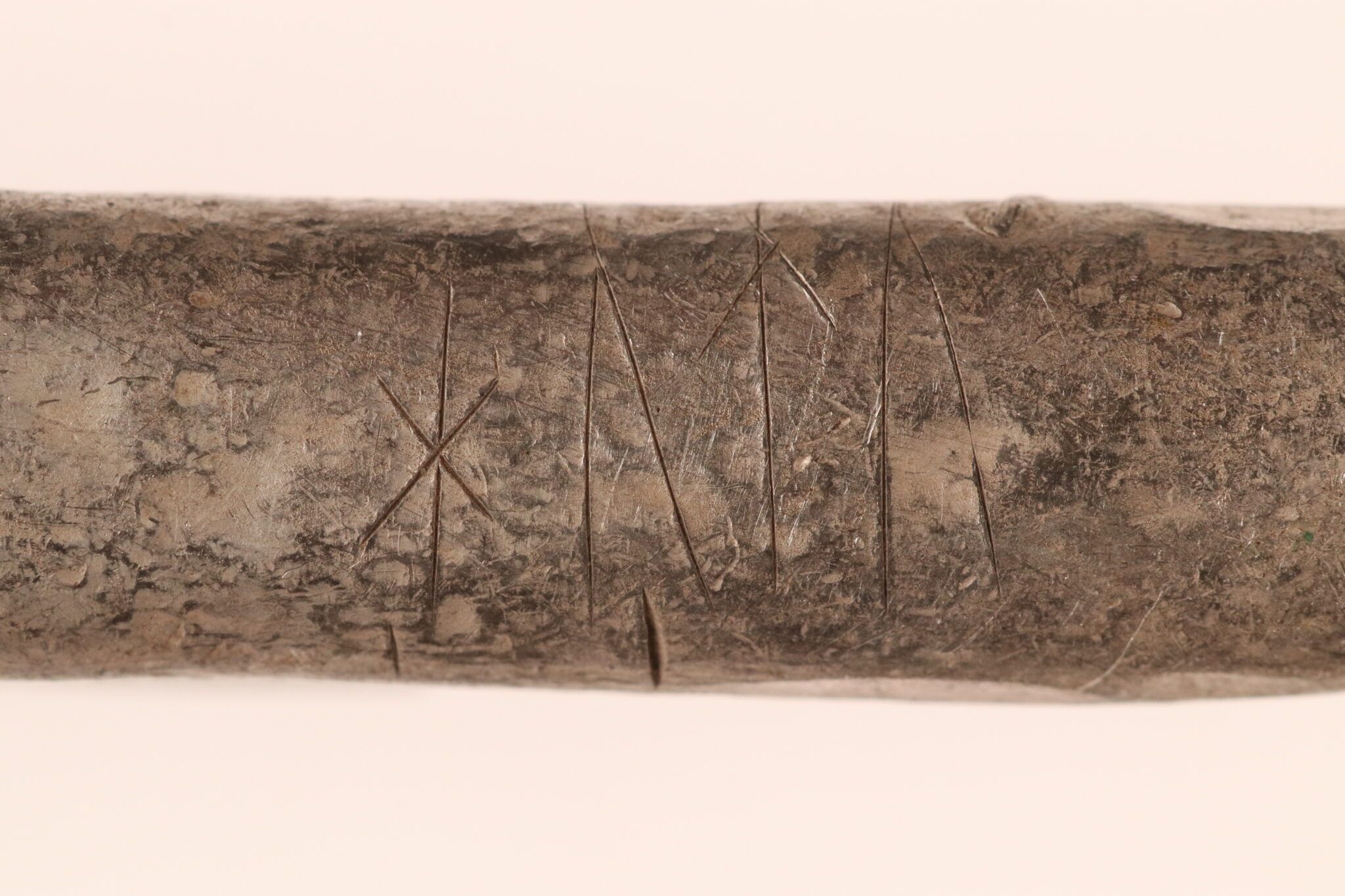 A close up of runs on a silver bar.