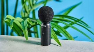 the black shure movemic 88+ for phone-first content creation, with wireless bluetooth connection and a receiver for camera connection