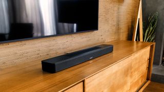 Bose Smart Soundbar 600 in front of a TV
