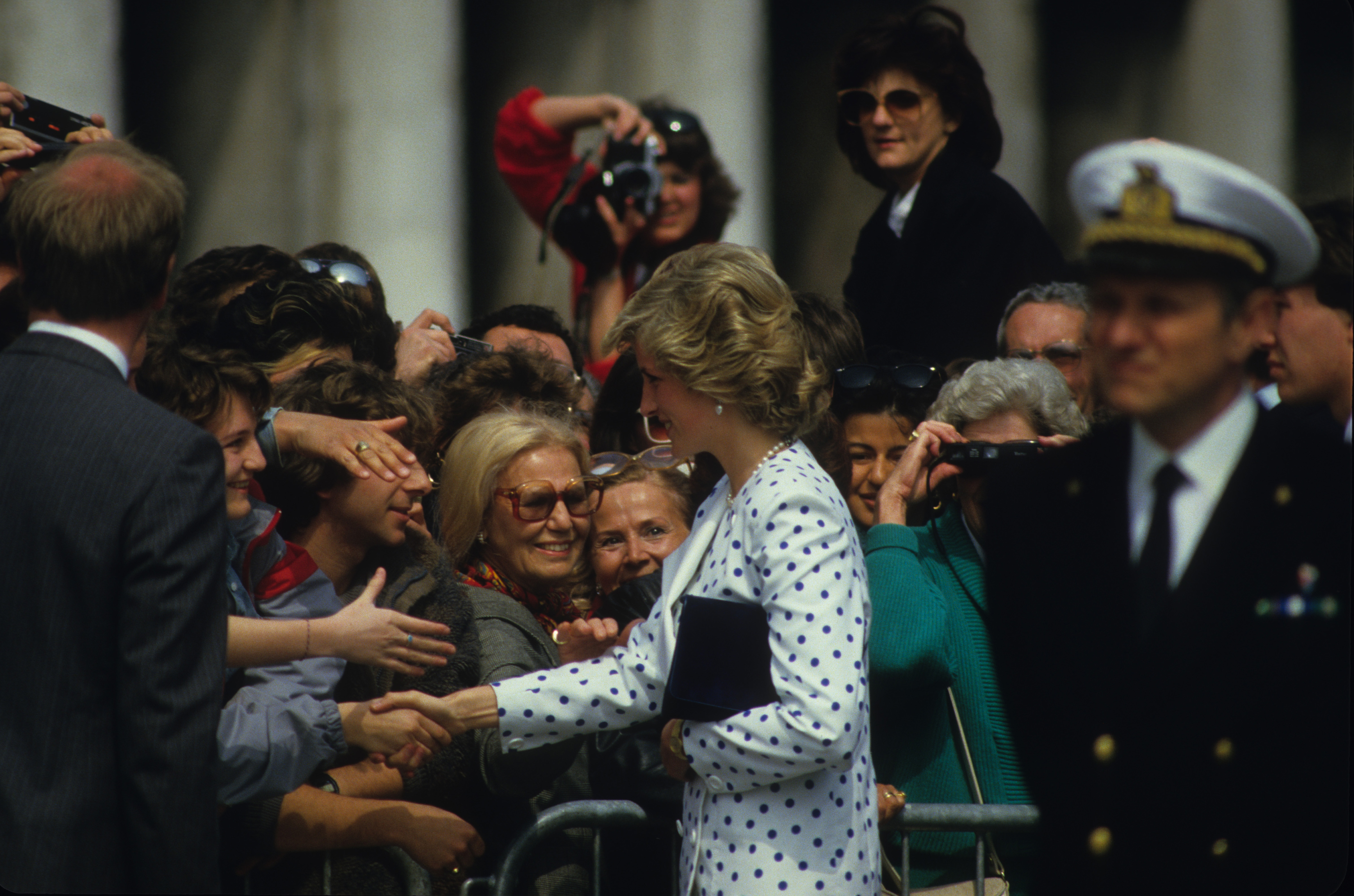 Princess Diana shaking hands with fans in Italy
