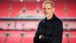 Thomas Tuchel poses in Wembley Stadium, arms folded and rows of red seats in the background, as he is announced as the new England manager on 16 October 2024