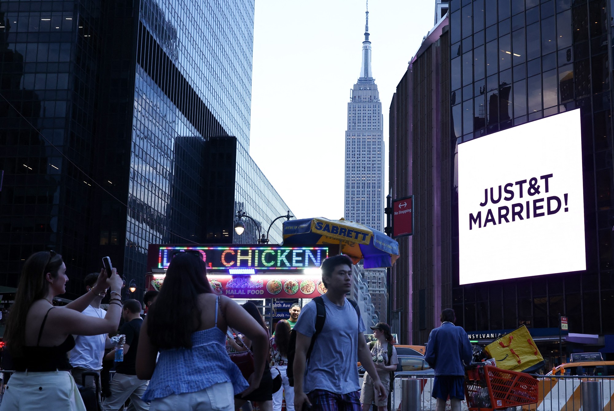 A giant screen showing the message "JUST&amp;amp;T MARRIED!" (T&amp;amp;T for Taylor and Travis) outside Madison Square Garden on July 3, 2026.