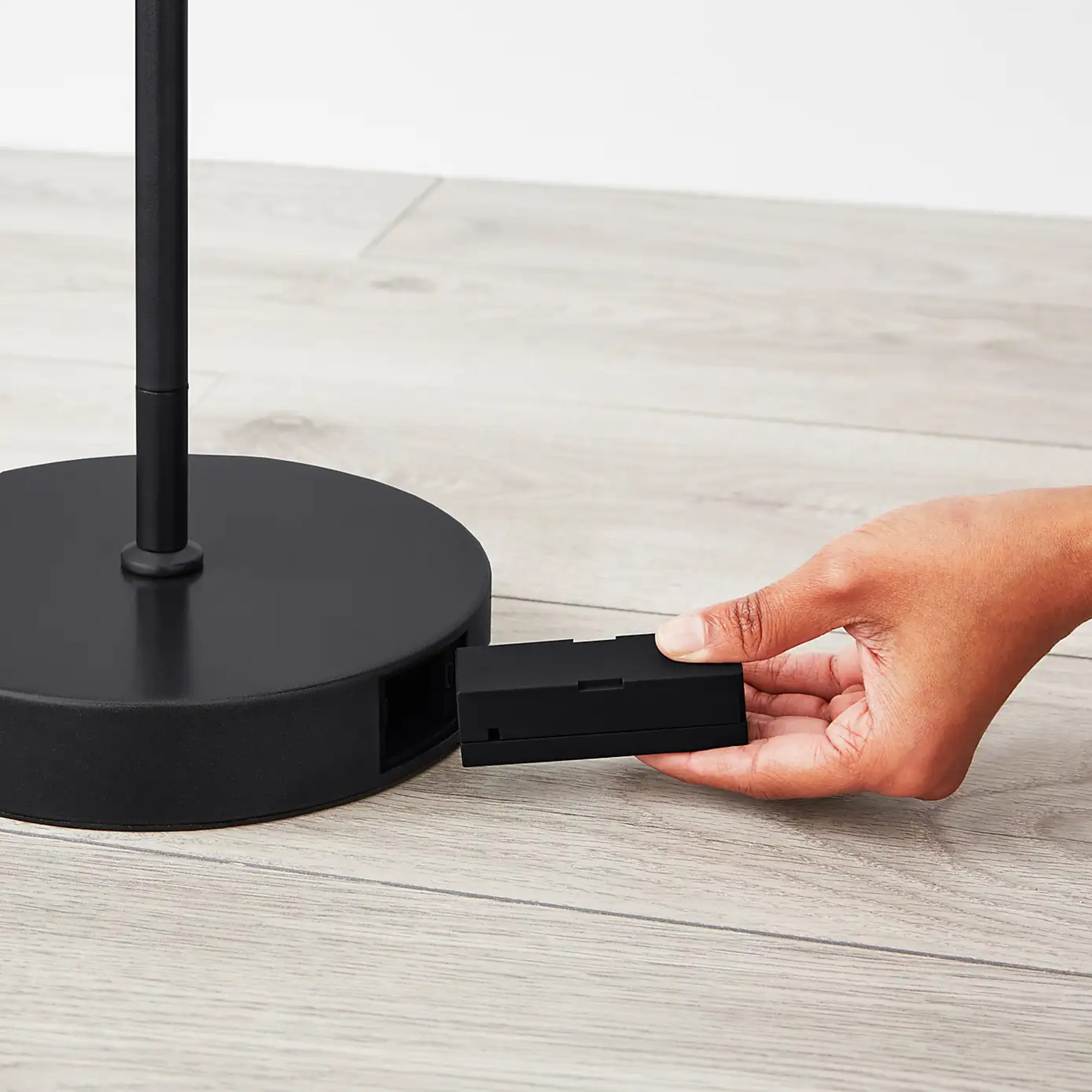 The base of Dunelm's FlexiCell Chester Rechargeable Touch Dimmable LED Floor Lamp with the battery being taken out