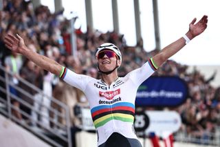 Alpecin - Deceuninck team's Dutch rider Mathieu Van Der Poel celebrates as he cycles past the finish line to win the 121st edition of the Paris-Roubaix one-day classic cycling race, 260km between Compiegne and Roubaix, northern France, on April 7, 2024. (Photo by Anne-Christine POUJOULAT / AFP)