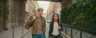 Dexter and Emma walk through the streets of Paris.
