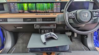 PS5 sitting on center console in Honda e