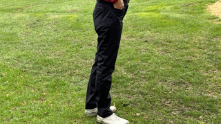 A golfer poses in the Galvin Green Levana Golf Pants