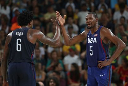 DeAndre Jordan and Kevin Durant celebrate a play against Spain.