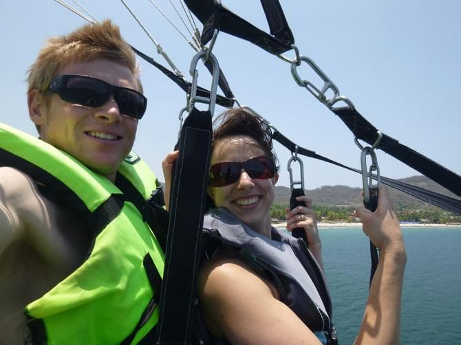 Parasailing behind a boat on Playa La Ropa
