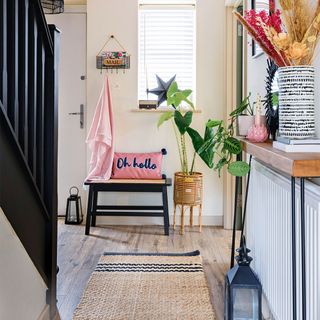 Hallway with bench and floor runner