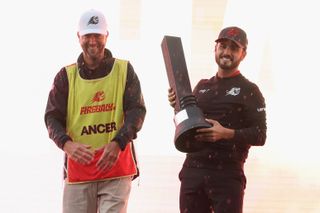 Abraham Ancer holds a trophy after winning LIV Golf Hong Kong