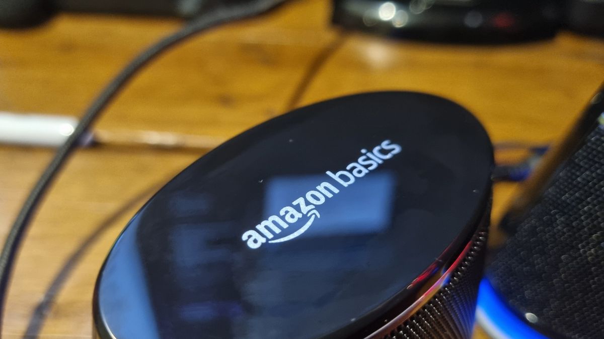 The Amazon Basics Stereo 2.0 speakers on a desktop, shot from various angles